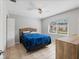 Cozy bedroom with a large window, neutral tile, and a comfortable queen size bed at 9737 86Th Ave, Seminole, FL 33777