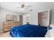 Bright bedroom featuring tile floors, a comfortable queen bed, and a spacious closet at 9737 86Th Ave, Seminole, FL 33777