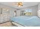 Bright bedroom featuring a window and dresser with mirror at 9737 86Th Ave, Seminole, FL 33777