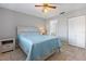 Cozy bedroom with neutral paint, tile floors, and a large closet at 9737 86Th Ave, Seminole, FL 33777