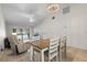 Open-concept dining room with chandelier and sliding glass doors to an outdoor patio area at 9737 86Th Ave, Seminole, FL 33777