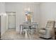 Bright dining area featuring a modern chandelier, tile flooring, and comfortable seating at 9737 86Th Ave, Seminole, FL 33777