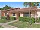 Attractive home exterior with red tile roof, lush landscaping, and a welcoming walkway at 9737 86Th Ave, Seminole, FL 33777