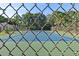 Community tennis court surrounded by lush greenery, promoting an active lifestyle at 9737 86Th Ave, Seminole, FL 33777