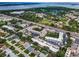 Aerial view of neighborhood showcasing tree lined streets, water views and the surrounding community at 9945 47Th N Ave # 210, St Petersburg, FL 33708