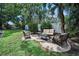 Inviting backyard patio with cushioned seating and lush landscaping at 9945 47Th N Ave # 210, St Petersburg, FL 33708