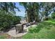 Backyard patio with outdoor seating, lush landscaping and privacy fence at 9945 47Th N Ave # 210, St Petersburg, FL 33708