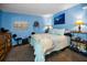 Cozy bedroom with decorative artwork, accent lighting and comfortable furniture at 9945 47Th N Ave # 210, St Petersburg, FL 33708