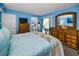 Comfortable bedroom features plush carpet, a large dresser and private ensuite bathroom at 9945 47Th N Ave # 210, St Petersburg, FL 33708