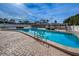 A large community pool with lounge chairs provides a resort-like experience for residents at 9945 47Th N Ave # 210, St Petersburg, FL 33708