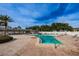 The community pool with adjacent lounge area offers a relaxing outdoor retreat with ample seating at 9945 47Th N Ave # 210, St Petersburg, FL 33708