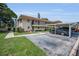 Well-maintained condo building with covered parking, landscaped grounds, and inviting curb appeal at 9945 47Th N Ave # 210, St Petersburg, FL 33708