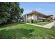 Manicured lawn and mature trees complement this building's exterior at 9945 47Th N Ave # 210, St Petersburg, FL 33708