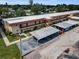 Property featuring multiple units with balconies and convenient covered parking for residents and guests at 9945 47Th N Ave # 210, St Petersburg, FL 33708