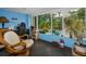 Sunroom with beautiful large windows, desk, and tile floors provides lots of natural light at 9945 47Th N Ave # 210, St Petersburg, FL 33708