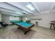 A game room with a pool table, bar stools, and plenty of room to play at 9945 47Th N Ave # 210, St Petersburg, FL 33708