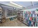 A library with floor to ceiling bookshelves and wood-look floors at 9945 47Th N Ave # 210, St Petersburg, FL 33708