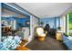 Open floorplan with adjacent office space featuring tile floors, plenty of light and blue walls at 9945 47Th N Ave # 210, St Petersburg, FL 33708