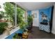 Relaxing sunroom with lots of natural light, tile flooring and view to the garden at 9945 47Th N Ave # 210, St Petersburg, FL 33708