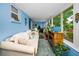 Cozy sunroom featuring comfortable seating, and large windows providing ample sunlight at 9945 47Th N Ave # 210, St Petersburg, FL 33708