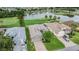 Aerial view of homes nestled on a golf course and a pond at 10232 Buncombe Way, San Antonio, FL 33576