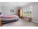 Comfortable bedroom featuring a bright window and classic decor at 10232 Buncombe Way, San Antonio, FL 33576