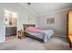 Cozy bedroom with an ensuite bathroom and a comfortable bed at 10232 Buncombe Way, San Antonio, FL 33576