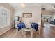 Dining area with a round table set next to a sunlit window at 10232 Buncombe Way, San Antonio, FL 33576