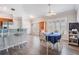 Bright dining area with neutral walls, hardwood floors, and large windows at 10232 Buncombe Way, San Antonio, FL 33576