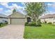 Beautiful one-story home with a well-maintained lawn and attractive landscaping at 10232 Buncombe Way, San Antonio, FL 33576