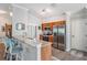 Bright kitchen with wooden cabinets, stainless steel appliances, and a breakfast bar at 10232 Buncombe Way, San Antonio, FL 33576