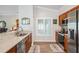 Modern kitchen featuring quartz countertops, stainless steel appliances, and hardwood floors at 10232 Buncombe Way, San Antonio, FL 33576