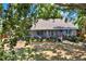A beautifully landscaped backyard with screened lanai and hot tub at 10314 Deepbrook Dr, Riverview, FL 33569