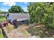 Aerial shot of a home with a screened in patio, shed, and fenced yard at 10314 Deepbrook Dr, Riverview, FL 33569