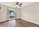 Bedroom featuring hardwood floors and a window view at 10314 Deepbrook Dr, Riverview, FL 33569
