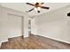 Bedroom featuring hardwood floors and a closet at 10314 Deepbrook Dr, Riverview, FL 33569