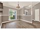Dining room with neutral walls, crown molding, and hardwood floors at 10314 Deepbrook Dr, Riverview, FL 33569