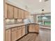 Open kitchen featuring wood cabinets, mosaic backsplash, and stainless steel appliances and hardware at 10314 Deepbrook Dr, Riverview, FL 33569