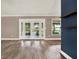 Spacious living room with hardwood floors and french doors to patio at 10314 Deepbrook Dr, Riverview, FL 33569