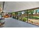 Large screened-in patio with hot tub, landscaping, and an outdoor living area at 10314 Deepbrook Dr, Riverview, FL 33569