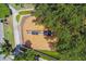 Aerial view of community playground seesaw with surrounding landscaping and fencing at 10422 Fenceline Rd, New Port Richey, FL 34655