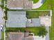 Aerial view of the property highlighting the yard, patio, and driveway at 10422 Fenceline Rd, New Port Richey, FL 34655