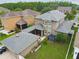 Aerial view of a screen enclosed porch area and detached garage at 10422 Fenceline Rd, New Port Richey, FL 34655
