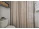 Bathroom showcasing a decorative shower curtain and neutral decor at 10422 Fenceline Rd, New Port Richey, FL 34655