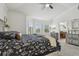 Bright bedroom featuring large windows and ceiling fan at 10422 Fenceline Rd, New Port Richey, FL 34655