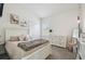 Comfortable bedroom featuring neutral tones, a closet, and plenty of natural light at 10422 Fenceline Rd, New Port Richey, FL 34655