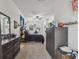 Bedroom features a ceiling fan, carpeted floors, and dresser at 10422 Fenceline Rd, New Port Richey, FL 34655