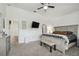 Bedroom with ceiling fan, large windows, ceiling fan, and neutral color palette at 10422 Fenceline Rd, New Port Richey, FL 34655