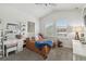 Bright bedroom with natural light, vaulted ceiling, and functional vanity at 10422 Fenceline Rd, New Port Richey, FL 34655