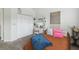 Cozy bedroom featuring closet and shelves, with ample natural light at 10422 Fenceline Rd, New Port Richey, FL 34655